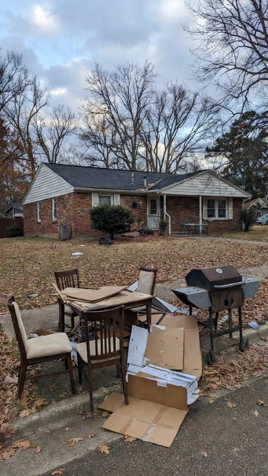 Furniture and household junk staged curbside for pickup