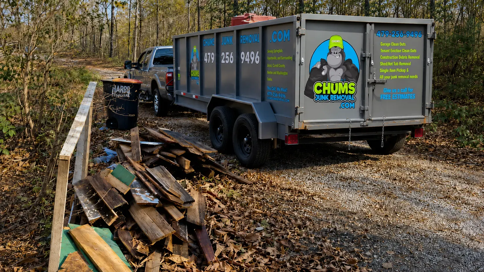The Chums Junk Removal truck and branded trailer at a junk removal job in Northwest Arkansas