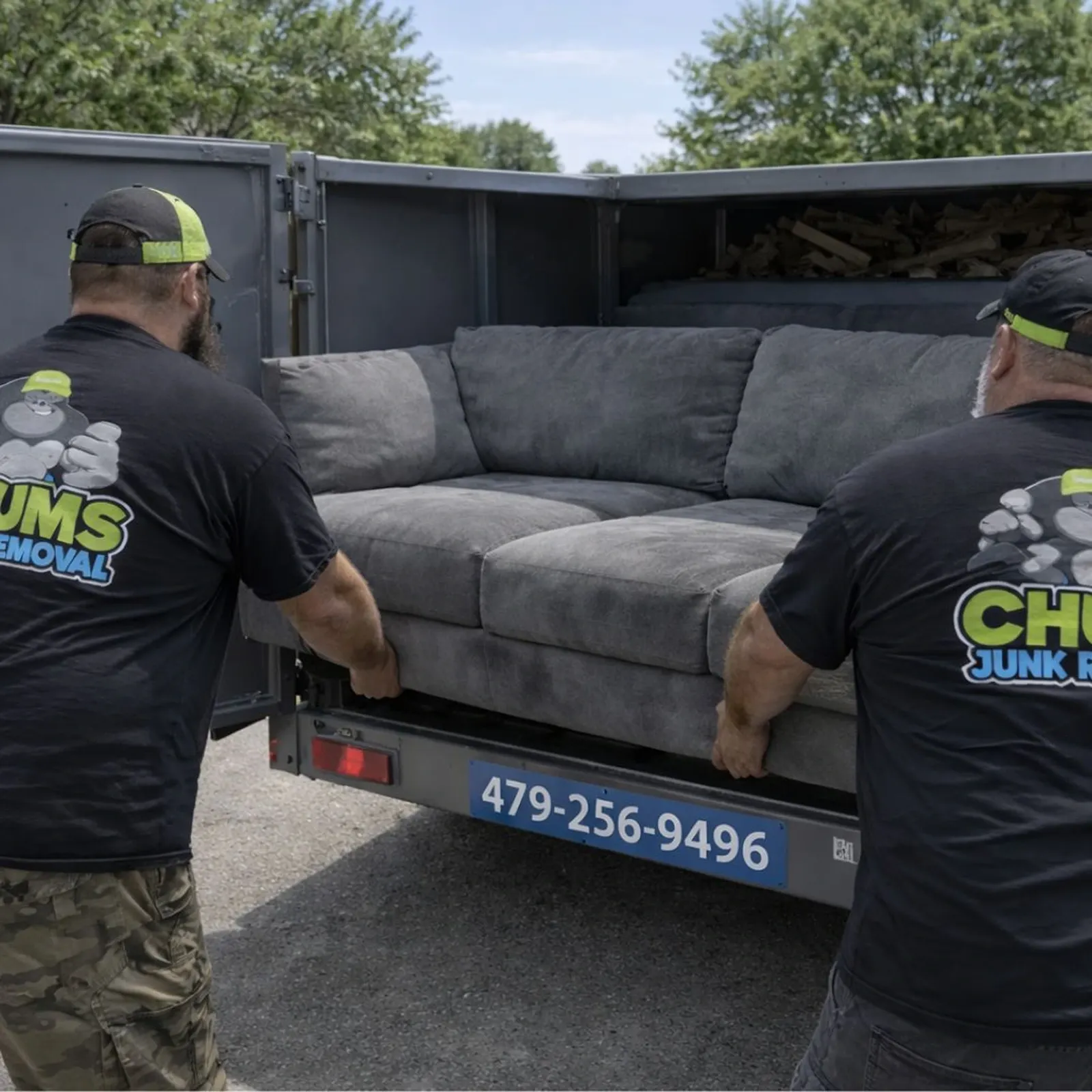 Chums crew loading a couch during a furniture removal in Northwest Arkansas
